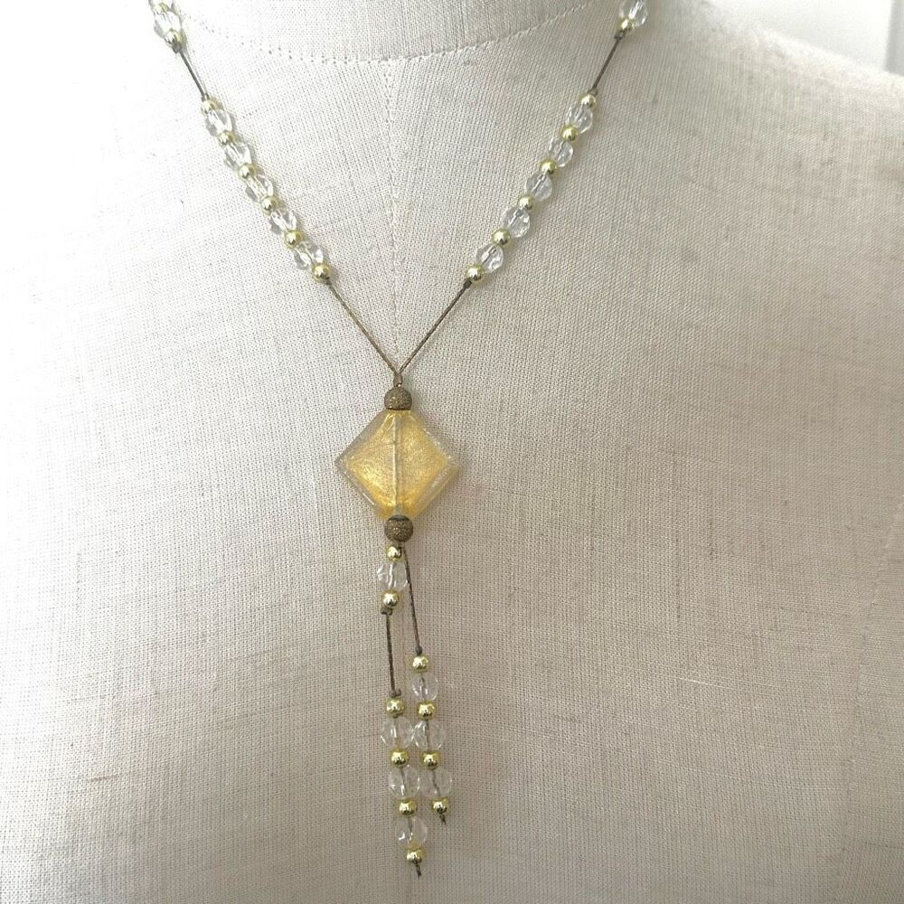Yellow clear and gold tone beaded pendant necklace